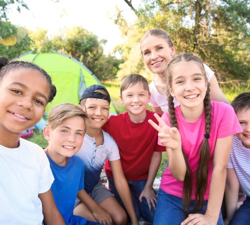 Group of children taking selfie at summer camp